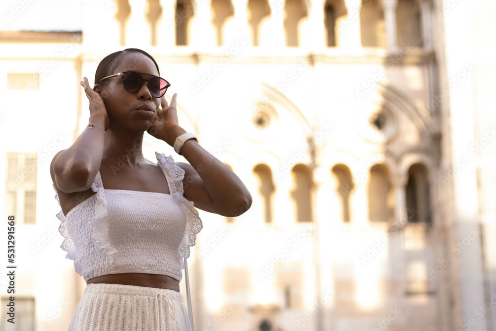 Portrait of African American woman dressed in white getting to know Europe, Ferrara. Italy Portrait of African American woman dressed in white getting to know Europe, Ferrara. Italy