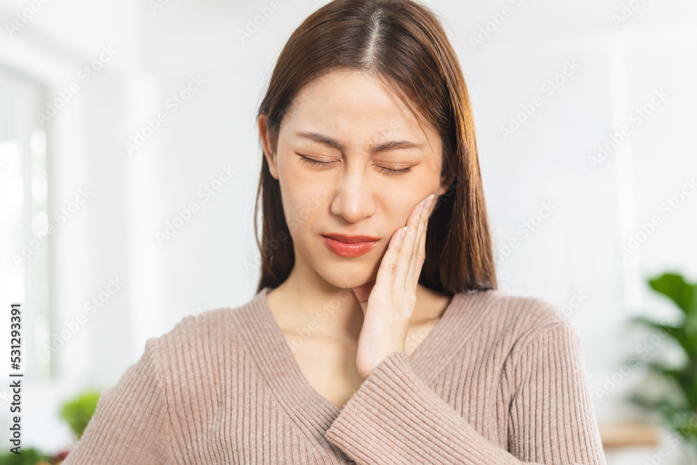 Face expression suffering from sensitive teeth and cold, asian young woman, girl feeling hurt, pain touching cheek, mouth with hand. Toothache molar tooth, dental problem isolated on white background. Face expression suffering from sensitive teeth and cold, asian young woman, girl feeling hurt, pain touching cheek, mouth with hand. Toothache molar tooth, dental problem isolated on white background.