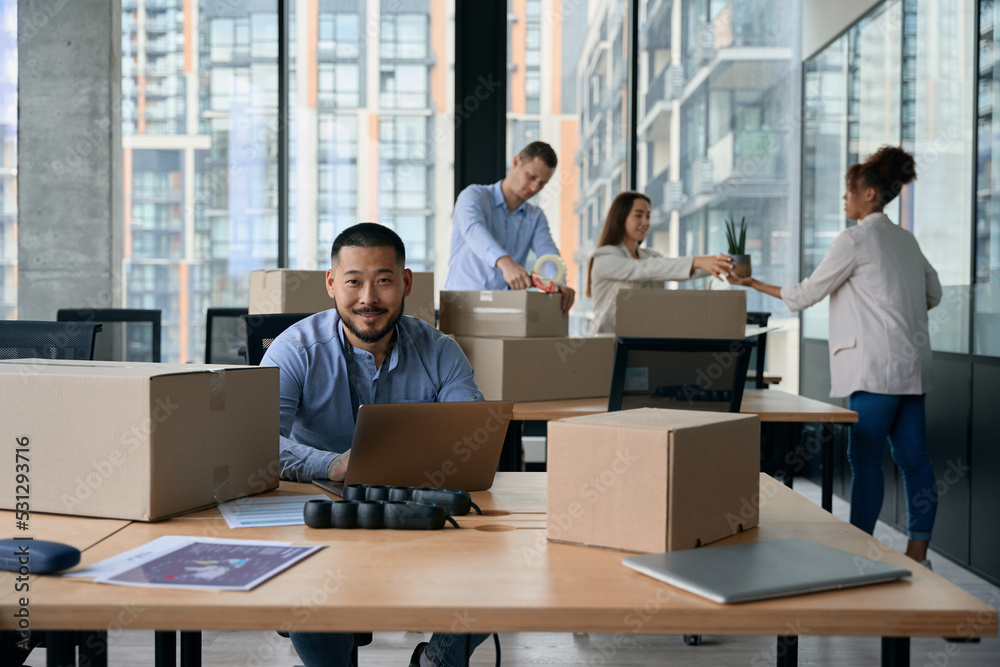 Group of company employees preparing for office relocation Group of company employees preparing for office relocation
