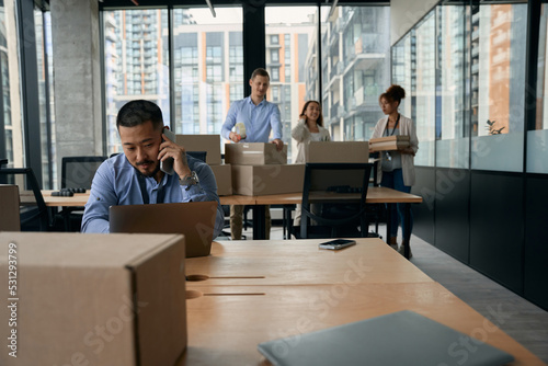 Team of corporate employees preparing for office move