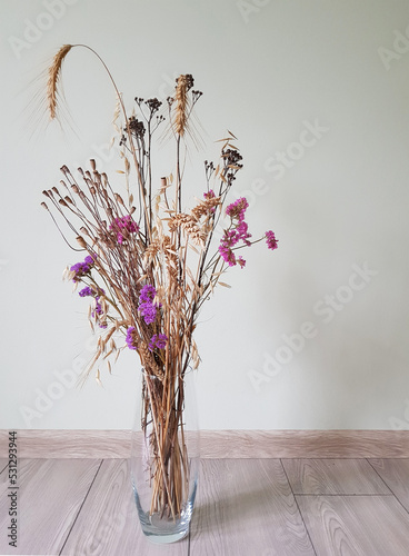 bouquet of wheat with wild flowers on a light background wallpaper