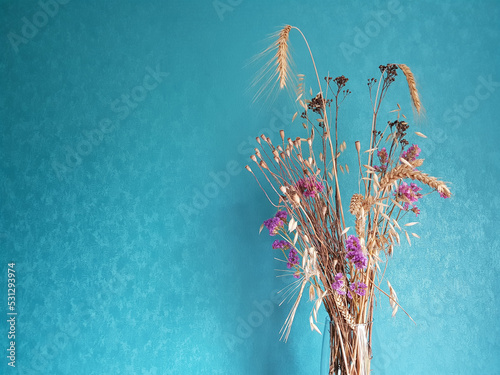bouquet wheat with wildflowers on dark turquoise background wallpaper