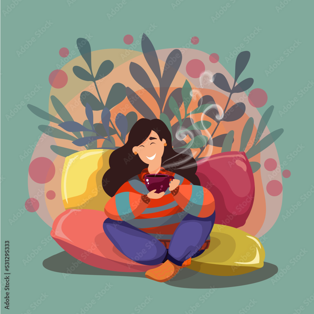 Girl sitting on pillows with a cup in her hands