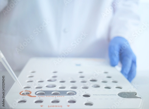 Laboratory worker. Illumina next generation sequencing. genetic engineering, genetic modification, designer baby and cloning concept. cancer screening and medical technology photo