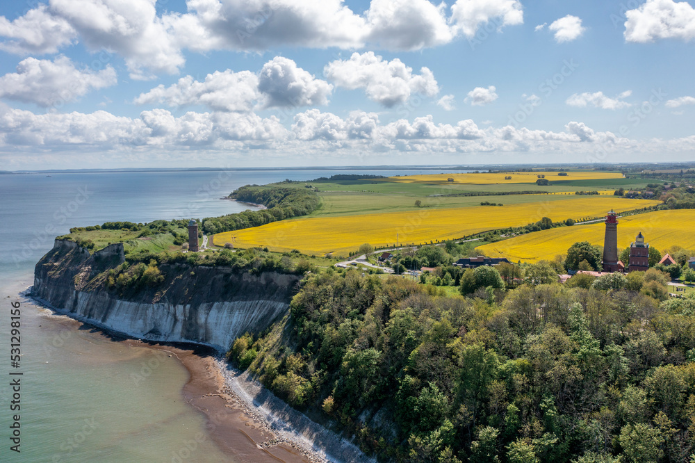 The island Ruegen Germany with many rape fields and lighthouse