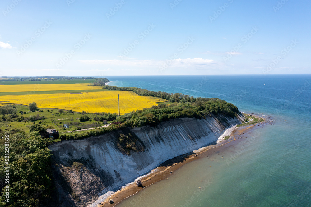 The island Ruegen Germany with many rape fields and lighthouse
