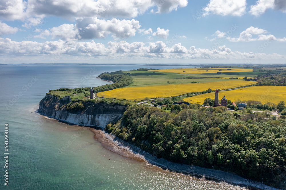 The island Ruegen Germany with many rape fields and lighthouse