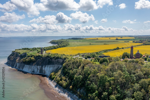 The island Ruegen Germany with many rape fields and lighthouse