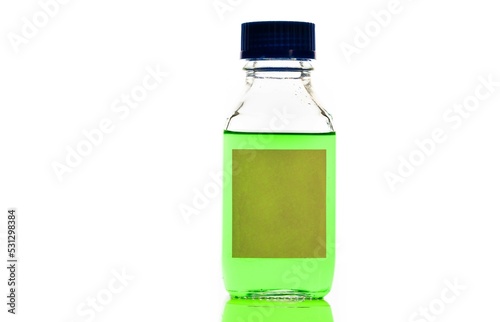 green chemical solution in a reagent bottle photo