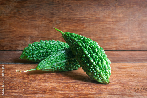 Wild bitter gourd on a wooden background.