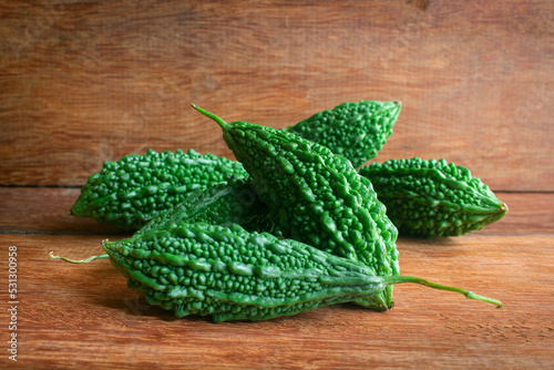Wild bitter gourd on a wooden background.
