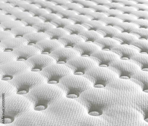 Top view hand made  white color mattress , close up mattress , background of comfortable bed , quilted white fabric. 