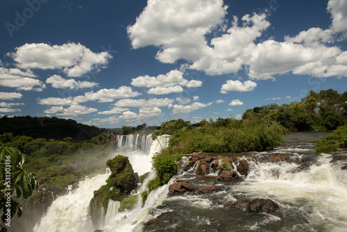 Natural world wonder. The Iguazu falls in Misiones, Argentina. View of San Martin fall. The waterfall's white water falling along the rocky precipice into the jungle.