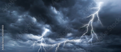Bilde på lerret The dark sky with heavy clouds converging and a violent lightning storm before the rain