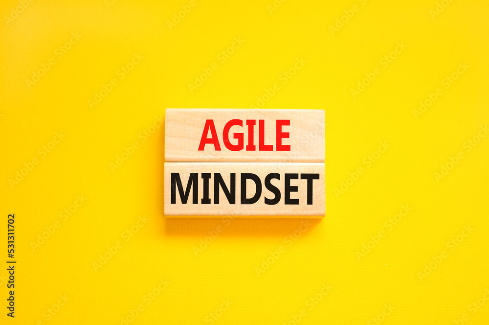 Agile mindset symbol. Concept words Agile mindset on wooden blocks. Beautiful yellow table yellow background. Business flexible and agile mindset concept. Copy space. Agile mindset symbol. Concept words Agile mindset on wooden blocks. Beautiful yellow table yellow background. Business flexible and agile mindset concept. Copy space.