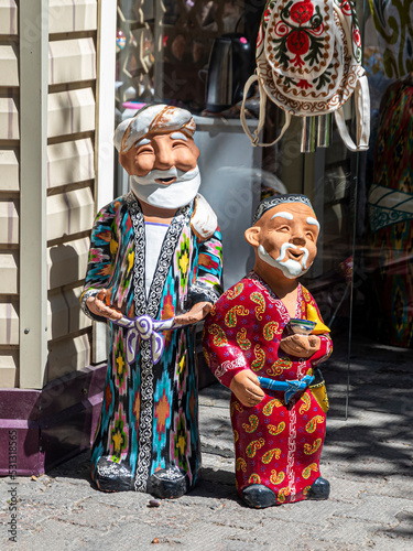 Two ceramic figurines in traditional Uzbek national clothes