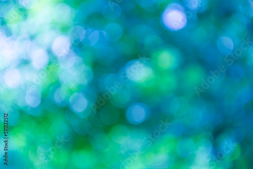 Abstract background of blue, green, turquoise bokeh.
