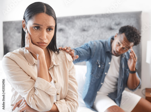 Couple fighting, sad woman ignore man who try stop conflict or divorce in home. Angry lady in bedroom, guy touch with hand wants communication or conversation about problem in house