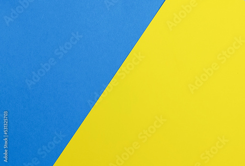 A graphic representation of two geometric shapes of two colors: yellow, blue.
