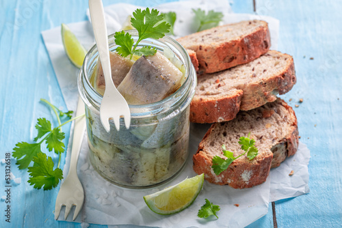 Delicious and fresh marinated herring in oil, onions and herbs.