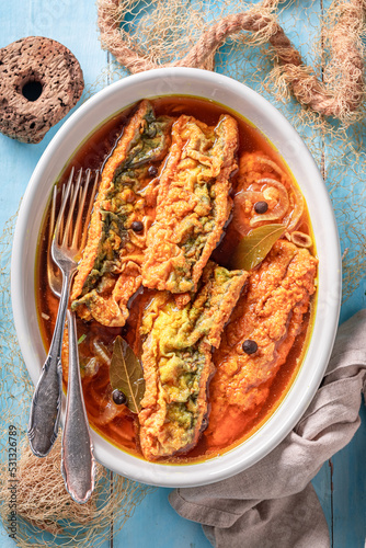 Healthy roasted mackerel pickled with allspice and bay leaf.