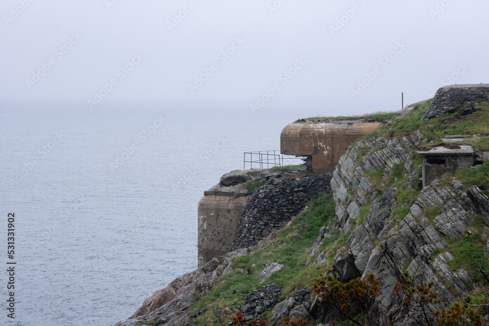 Herdla, Norway - June 16, 2022: Herdla Fort was built by the Germans during Second World War with batteries and bunker facilities. It's completed with a torpedo station in 1944. Selective focus
