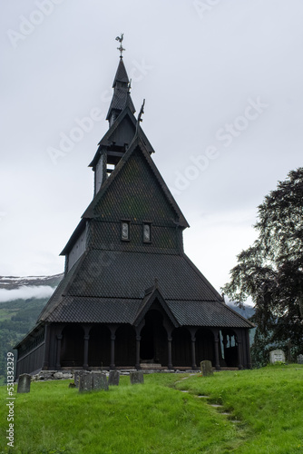 Vik i Sogn, Norway - June 19, 2022: Hopperstad Stave Church is a historic parish church of the Church of Norway. Village of Vikoyri in Vik municipality. Vestland. Cloudy spring day. Selective focus