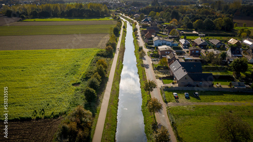 Aerial view of the Langelede canal crossing a residential area in Wachtebeke  Belgium