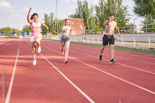 group of people training on the athletics track