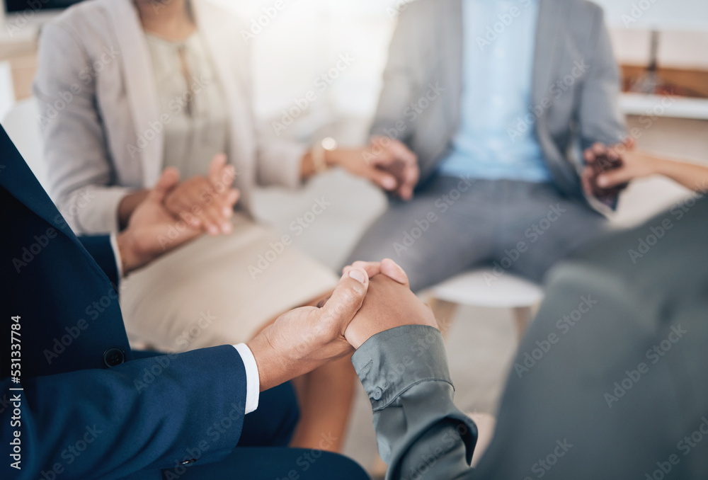 Business people holding hands in prayer, community trust and support in therapy, workshop and communication for mental health. Depression, anxiety or stress with employees or counseling in circle Business people holding hands in prayer, community trust and support in therapy, workshop and communication for mental health. Depression, anxiety or stress with employees or counseling in circle