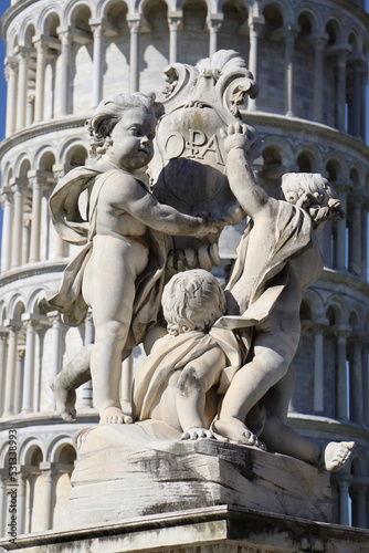 Angel statues in front of the Leaning Tower of Pisa, Italy