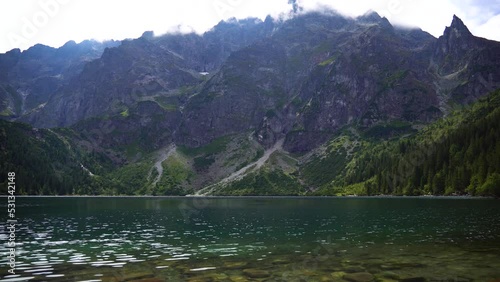 Morskie Oko (Sea Eye) is largest and fourth-deepest lake in Tatra Mountains. It is located deep within Tatra National Park, Poland, in Rybi Potok (Fish Brook) Valley, at base of Mieguszowiecki Summits photo