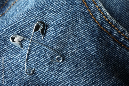 Wallpaper Mural Metal safety pins on denim fabric, closeup Torontodigital.ca