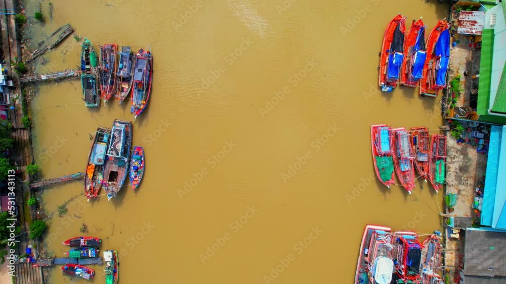 Drones are flying over fishing boats at Pak Nam Rayong, Rayong province, Thailand. fishing and seafood industry concept. 4k
Drones are flying over fishing boats at Pak Nam Rayong, Rayong province, Thailand. fishing and seafood industry concept. 4k