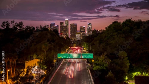 A 4K dusk to night timelapse of the Downtown Los Angeles skyline with cars and traffic heading into LA on the 110 Freeway. 