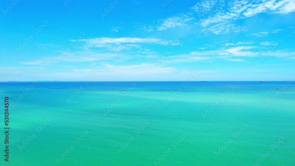 4K Aerial view of drone moving on beautiful sea, Flight over ocean. Dynamic aerial shot. Perfect for holiday summer background. Tropical sea in the Gulf of Thailand. Drone 4k shot.
