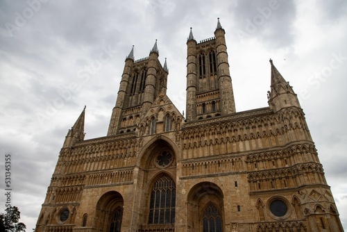 Low angle shot of the beautiful exterior of Lincoln Cathedral against a gloomy sky in United Kingdom