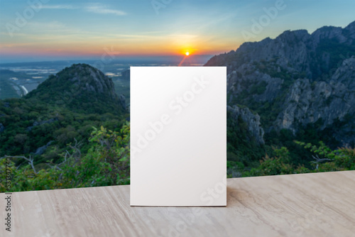 Table stand mockup. Mock up Label the blank menu frame with nature background.