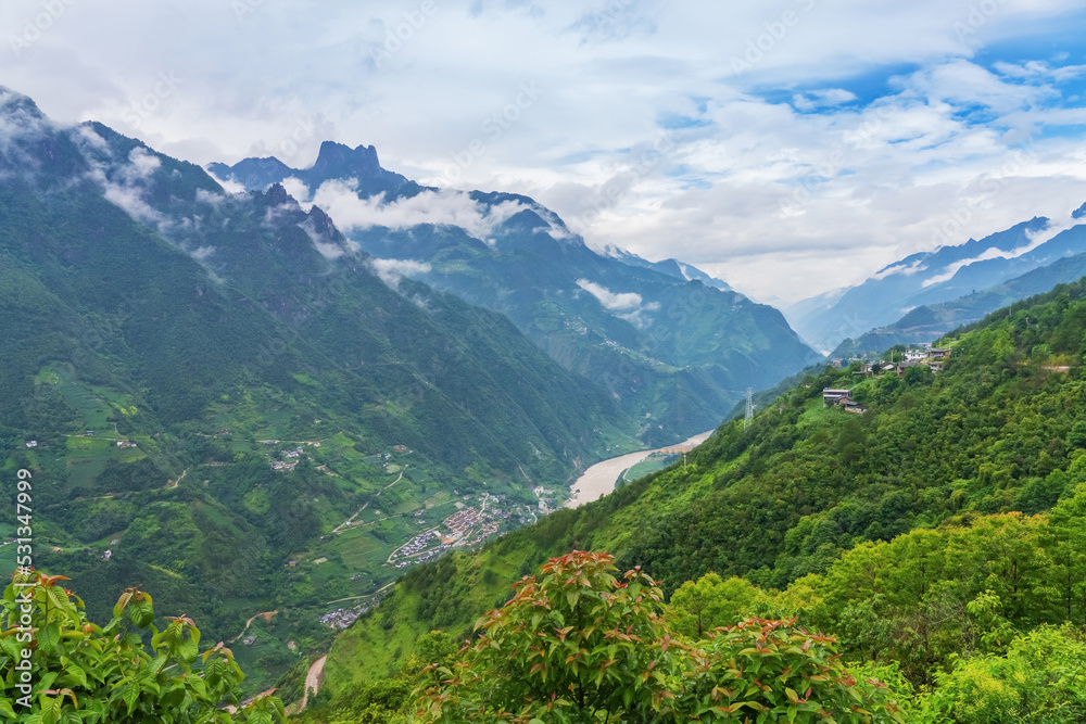 Obraz premium Beautiful scenery, rivers and villages in the plateau mountains of Tibet Autonomous Region of China