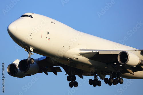 Boeing747-400 All White Colours cargo Aircraft landing.