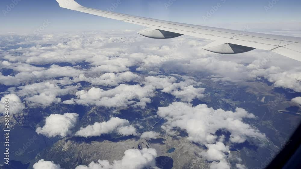 Beautiful scenic top view of blue sky and white clouds with horizon taken from airplane window shows concepts of climate environment and freedom of travelling on summer vacation for tourism. Beautiful scenic top view of blue sky and white clouds with horizon taken from airplane window shows concepts of climate environment and freedom of travelling on summer vacation for tourism.