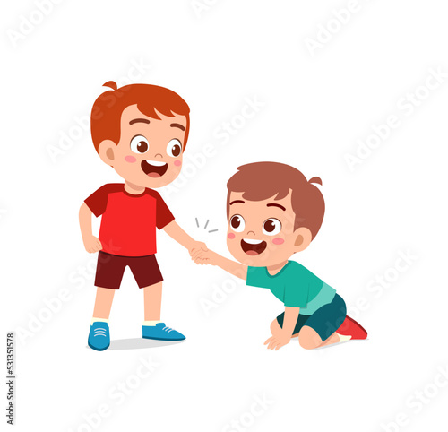 good little kid helping friend that falling on the floor
