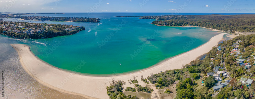 Aerial drone panoramic view of Maianbar Beach looking east to Burraneer and Bundeena on the Port Hacking estuary in the Sutherland Shire, Sydney during spring on a sunny day