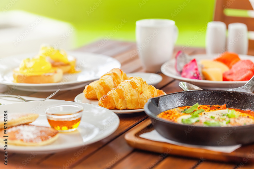 Healthy breakfast in outdoors cafe full of various colorful food Healthy breakfast in outdoors cafe full of various colorful food