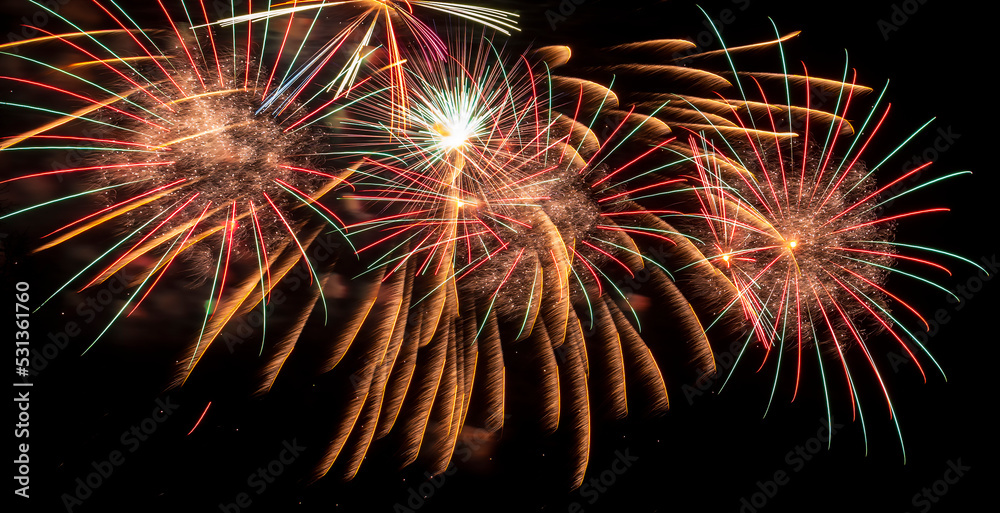 Fireworks - light festive show. Bright rays of light on black background of night sky. Fireworks. Fireworks - light festive show. Bright rays of light on black background of night sky. Fireworks.