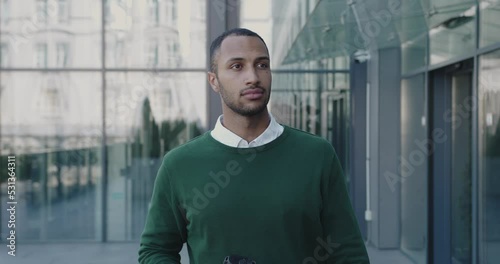 Businessman Walking On Street. Business Person Holding Coffee To Go Having Break. Business and Lifestyle Concept 