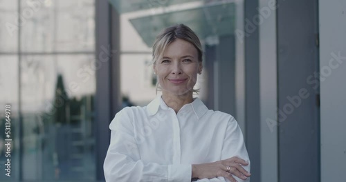 Portrait of Senior Smart Woman Smiling and Looking at the Camera. Entrepreneur Standing on Street. Woman Contemplating e-Business Ideas, e-Commerce Investment Strategy 