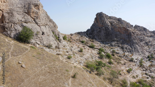 The desert surface of the sacred mountain of the city of Osh Sulaiman-Too. View of the amazing mountains.