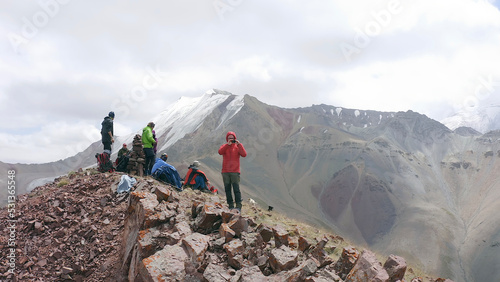 A group of climbers on the top of Mount Red Katya. Beautiful summer mountain landscape. photo