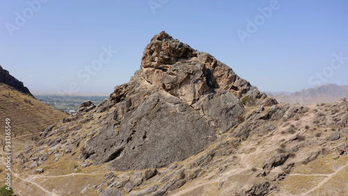 Aerial view of one of the peaks of the sacred mountain of Osh Sulaiman-Too. View of the amazing mountains.
